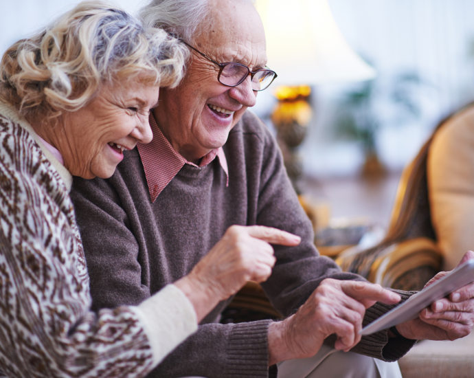 couple older with Ipad