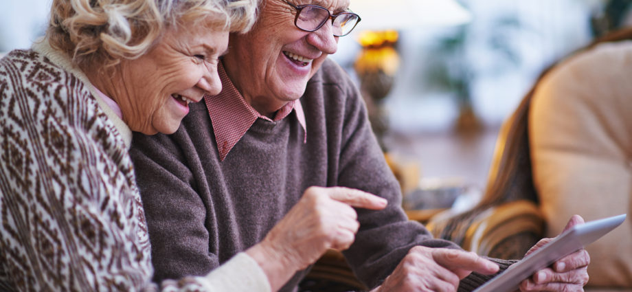 couple older with Ipad